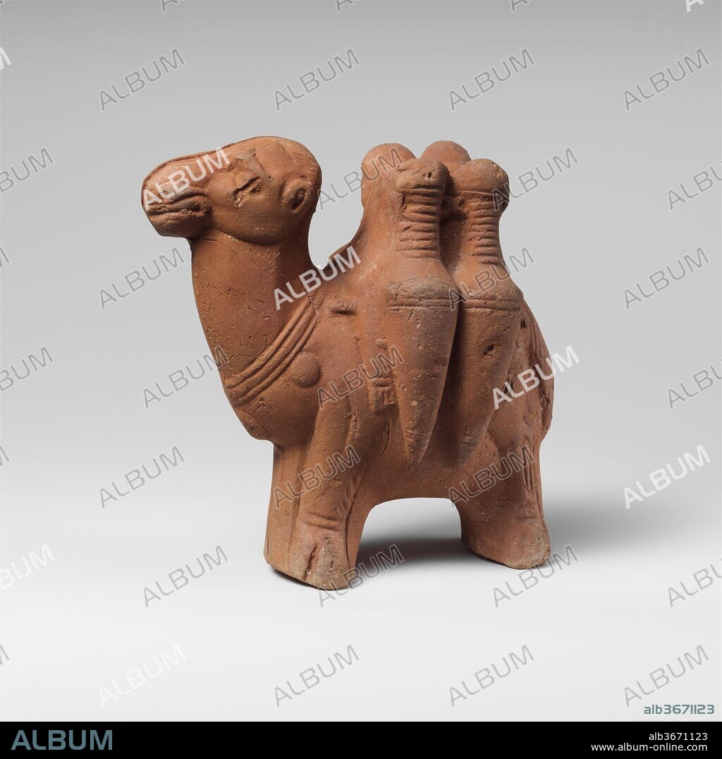 Terracotta figurine of a camel carrying transport amphorae. Culture: Roman, Egyptian. Dimensions: H.: 4 5/8 in. (11.8 cm). Date: late 2nd-early 3rd century A.D..
With four amphorae strapped to his back.