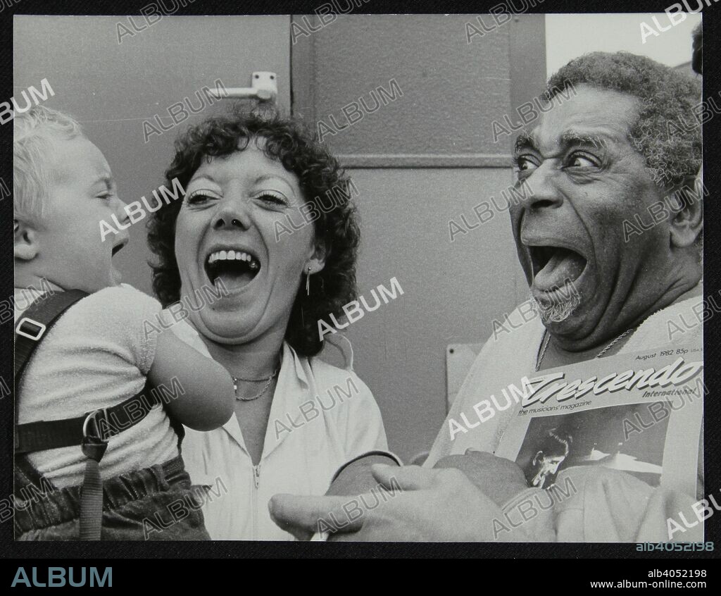 Dizzy Gillespie meeting baby Gary Colfer at Knebworth, Hertfordshire, July 1982. The baby's aunt and uncle Pat and Tony Shelvington kept the Lytton Arms pub in Old Knebworth.