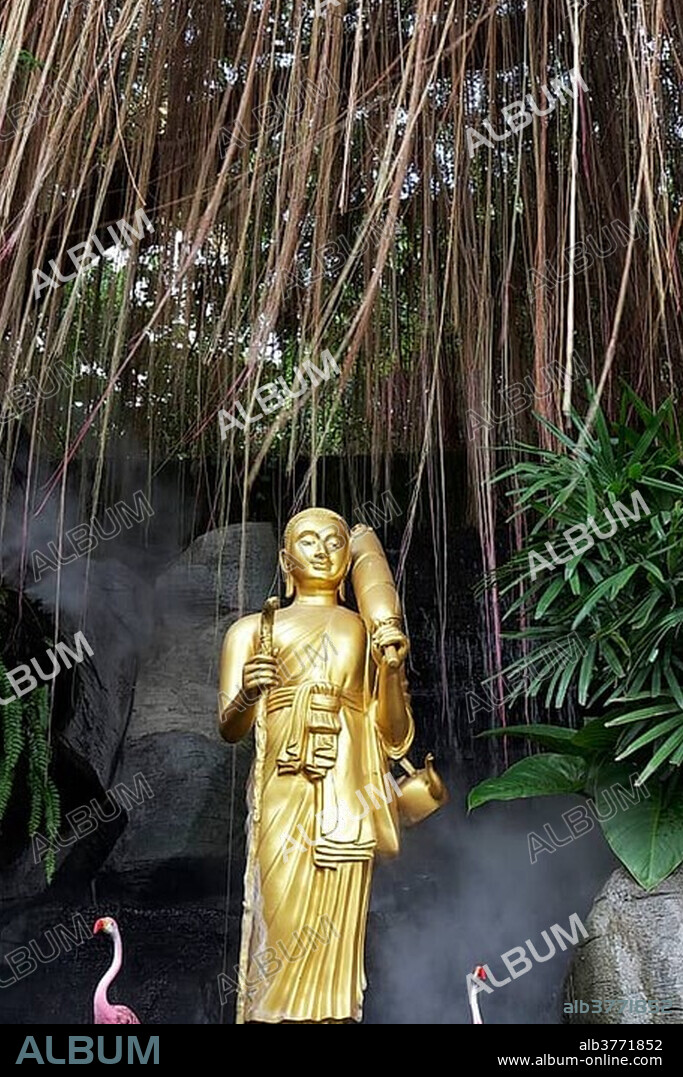 Buddha statue and artificial flamingos, staircase at Phu Khao Thong, Golden Mountain, in What Saket, Pom Prap Sattru Phai district, Bangkok, Thailand, Asia.