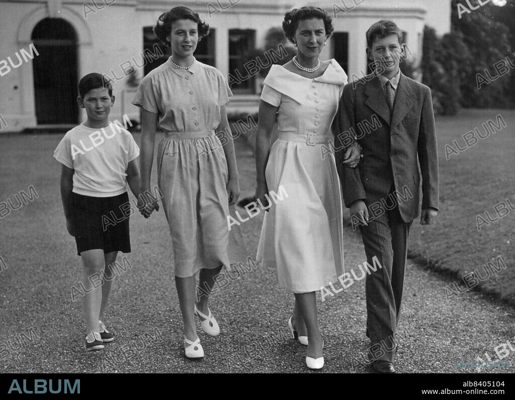 Duchess of Kent And Her Children -- A charming family picture of the Duchess of Kent and her children as they walk in the grounds of their home, "Coppins", Iver, Buckinghamshire. Left to right:- Prince Michael, Princess Alexandra, The Duchess of Kent and the Duke of Kent. August 14, 1950. (Photo by Paul Popper Ltd.).