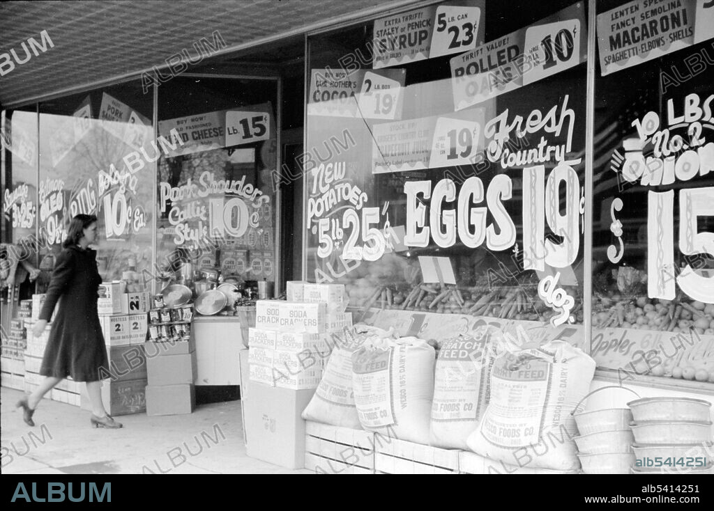 Grocery store, Salem, Illinois. A grocery store is a retail shop that primarily sells food. A grocer is a bulk seller of food. Grocery stores also offer non-perishable foods that are packaged in bottles, boxes, and cans; some also have bakeries, butchers, delis, and fresh produce. Large grocery stores that stock significant amounts of non-food products, such as clothing and household items, are called supermarkets. Arthur Rothstein, 1940 (cropped and cleaned).