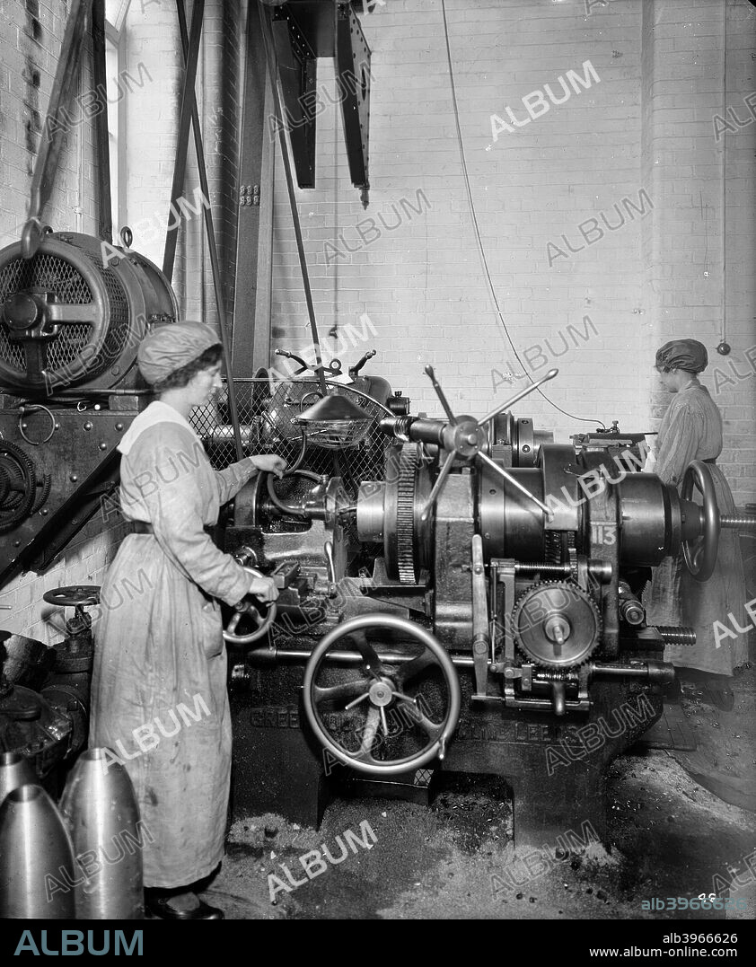 Cunard Shell Works, Birkenhead, Merseyside, 1917. The Ministry of Munitions, which was set up to oversee manufacturing of armaments during World War I, insisted that workers were supplied with suitable clothing for factory work. These suitably attired women are employed in a factory that specialised in the finishing of shells.