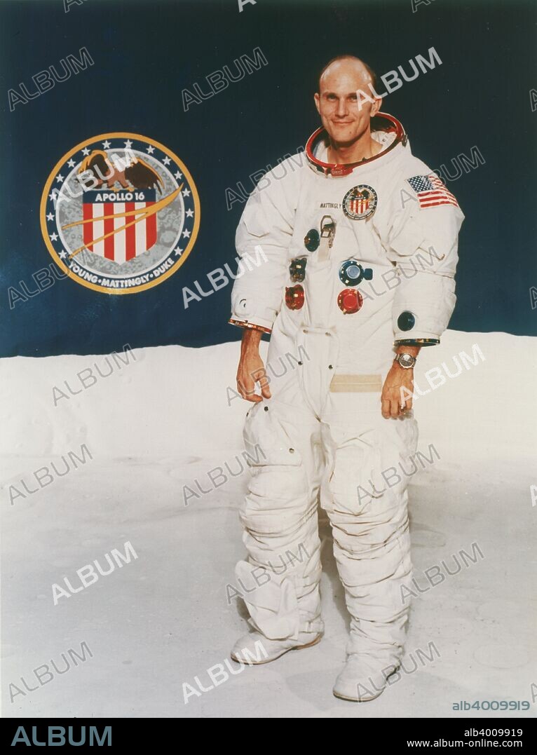 Apollo 16 astronaut Thomas Mattingly in spacesuit, 1971, pictured with the mission badge. Mattingly flew as the Command and Service Module pilot with astronauts, David Scott and John Young, on the Apollo 16 mission to the moon in April 1972. Mattingly remained in lunar orbit in his Command and Service Module while Young and Scott descended to become the 9th and 10th men to walk on the moon. Mattingly later flew on Space Shuttle missions 4 and 15.