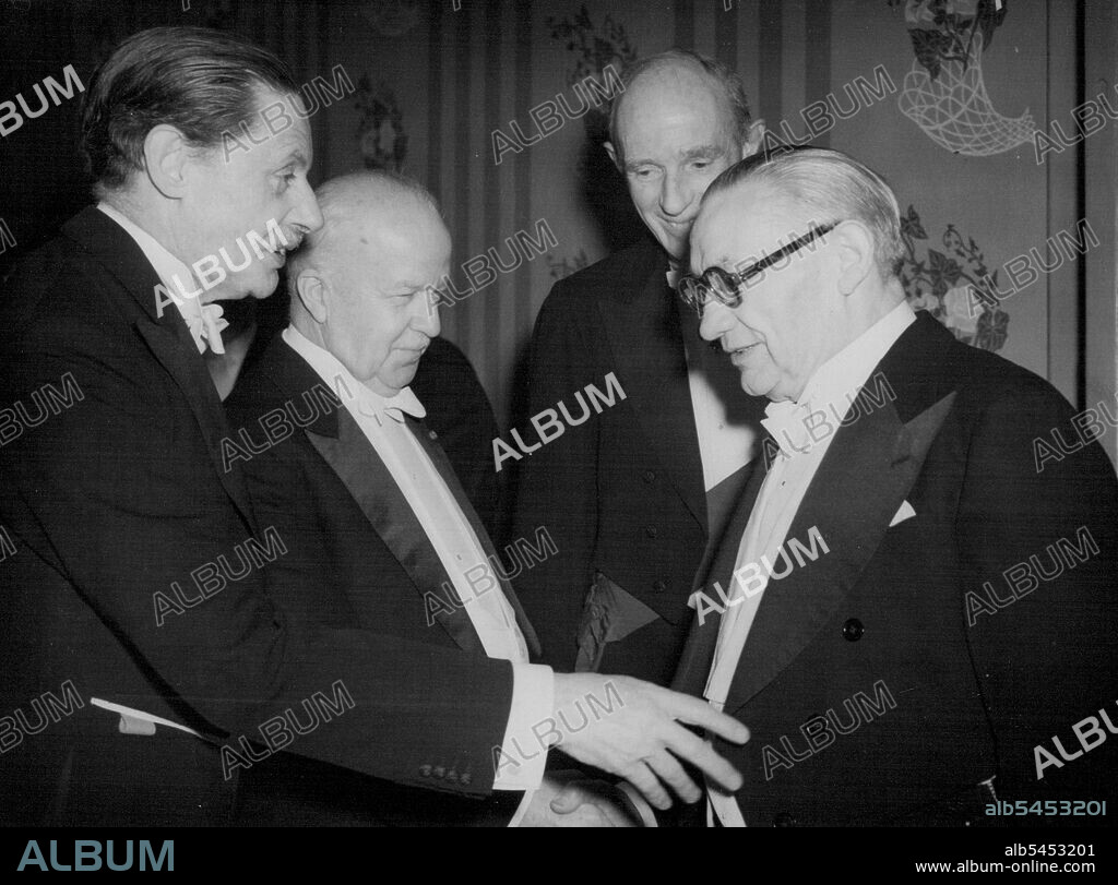 Mr. Gifford Meets Mr. Bevin Among The Pilgrims -- Mr. Walter Gifford (second from left) in an animated group comprising Mr. Ernest Bevin, the Foreign Secretary; Sir Campbell Stuart (on left), Vice-President of the Pilgrims; and Lord Halifax, the Pilgrims' President (behind) at the Savoy to-night. Mr. Walter Gifford, the new United States Ambassador in London, fulfilled his first public engagement since his arrival when to-night (Tuesday) the Pilgrims of Great Britain gave the traditional welcoming dinner for the Ambassador at the Savoy Hotel, London. January 9, 1951. (Photo by Reuterphoto).