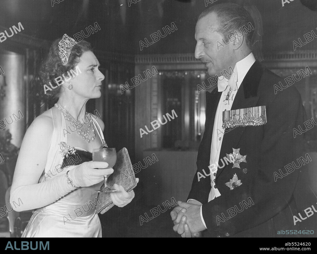 Duchess Attends Snow Ball -- The Duchess of Gloucester chats to Sir Frederick Browning.The Duchess of Gloucester attend the Snow ball in aid of the United Appeal for the Blind and the British Empire Society for the Blind, which was held at the Dorchester Hotel, London last night. December 16, 1954. (Photo by Evening Standard Picture).