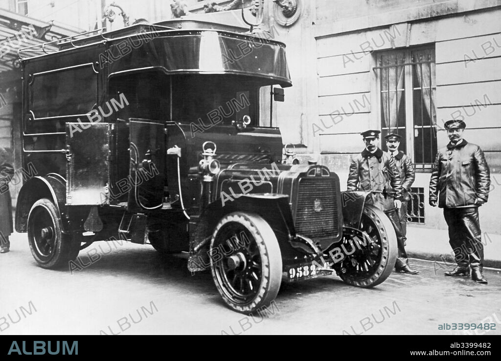 Paris, France:  c. 1913 Armored cars and guards are now used by banks in Paris to transport money and valuables after a rash of holdups and robberies of other less protected vehicles.