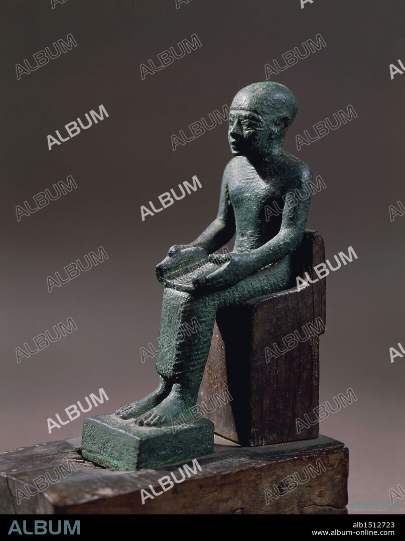 Egyptian civilization, Late Period. Bronze statuette depicting seated Imhotep, architect who designed the Step Pyramid at Saqqara and author of earliest medical treatises, considered the son of the god Ptah and worshipped as the god of medicine.