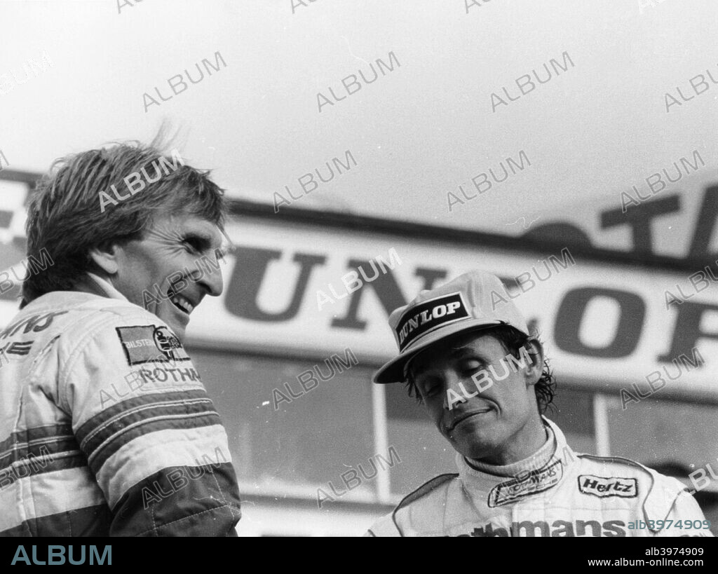 Derek Bell and Jacky Ickx, 1000km Silverstone, May 1985. Jacky Ickx was the winner of this race, together with his co-driver Jochen Mass, while Bell and Hans-Joachim Stuck finished second. Both pairings were driving Rothmans Porsches.