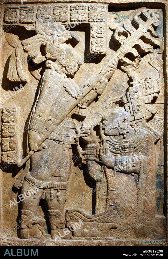 Maya Limestone Yaxchilan Lintel 24. Records a bloodletting ritual that took place on October 28, 709 AD. Shield Jaguar holds a torch while his consort, Lady Xoc, pulls a rope studded with what are now believed to be obsidian shards through her tongue in order to conjure a vision serpent. Itzamnaaj B'alam II was a Maya king who ruled in Yaxchilan from 681 until he died in 742. He is also called Shield Jaguar II by modern writers and commonly referred to simply as Shield Jaguar based on his name glyph before the phonetic name was deciphered. One of Itzamnaaj B'alam's greatest accomplishments was the construction of what is now called Temple 23. At Temple 23, Lady Xoc is shown performing a bloodletting ritual for three different occasions: his accession to the throne, the birth of his son and heir Yaxun B'alam, and the dedication of Temple 23. Lady Xoc is one of the most prominent and probably politically powerful women in the Maya.