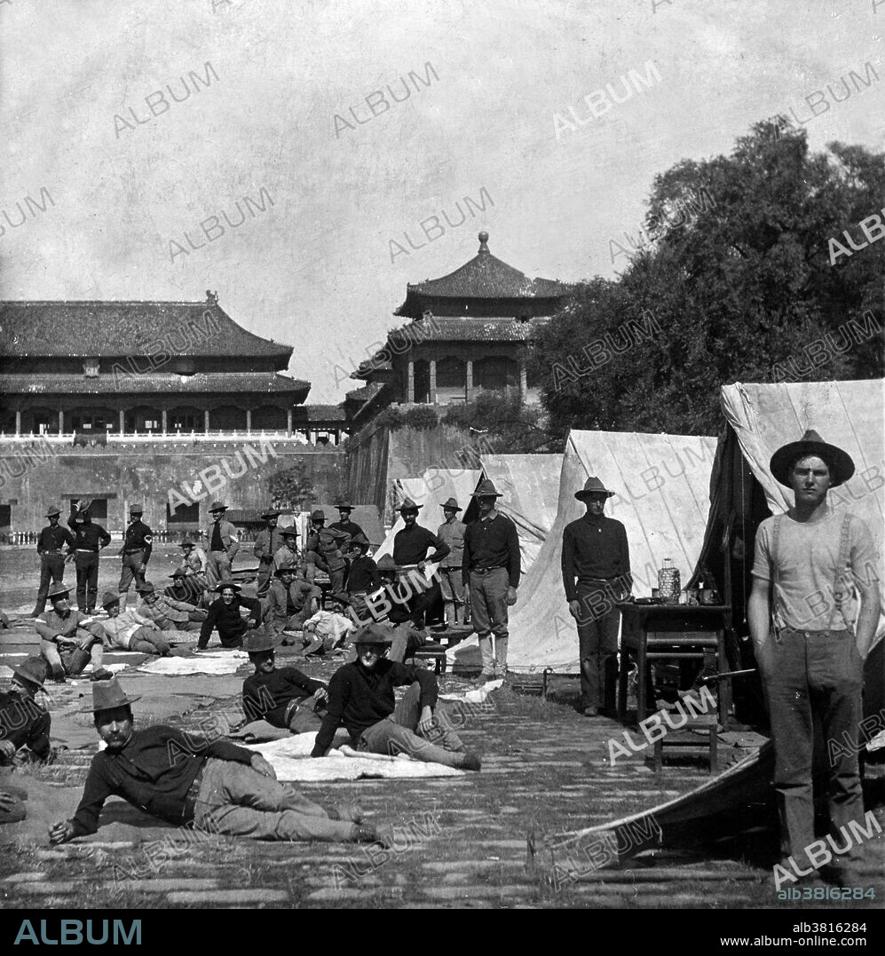 Entitled: "9th U.S. Infantry in Camp, in the court of the Forbidden City, Peking, China." The Forbidden City was the Chinese imperial palace from the Ming dynasty to the end of the Qing dynasty. It is located in the center of Beijing, China, and now houses the Palace Museum. It served as the home of emperors and their households as well as the ceremonial and political center of Chinese government for almost 500 years. It was called the Forbidden City because only the emperor, his court, and his servants were allowed to enter it without permission. In 1900 Empress Dowager Cixi fled from the Forbidden City during the Boxer Rebellion, leaving it to be occupied by forces of the treaty powers until the following year. The Boxer Rebellion was lead by a Chinese secret organization called the Society of the Righteous and Harmonious Fists against the spread of Western and Japanese influence there. Cropped stereograph card, Standard Scenic Company, circa 1900-01.