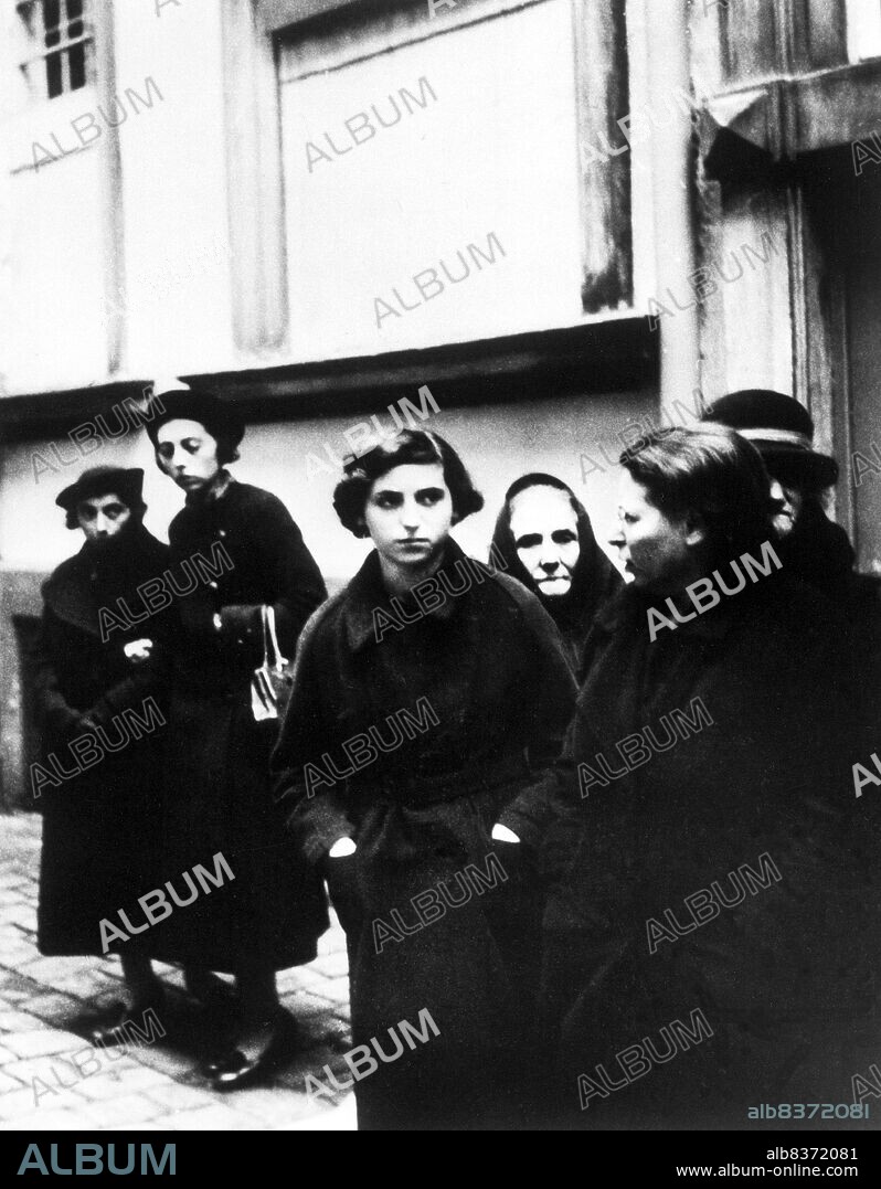 Kristallnacht or 'Crystal Night', also referred to as the Night of Broken Glass, was a pogrom against Jews throughout Nazi Germany and Austria that took place on 910 November 1938, carried out by SA (Sturmabteilung or Brownshirts) paramilitary forces and German civilians.<br/><br/>. German authorities looked on without intervening. The name Kristallnacht comes from the shards of broken glass that littered the streets after Jewish-owned stores, buildings, and synagogues had their windows smashed.