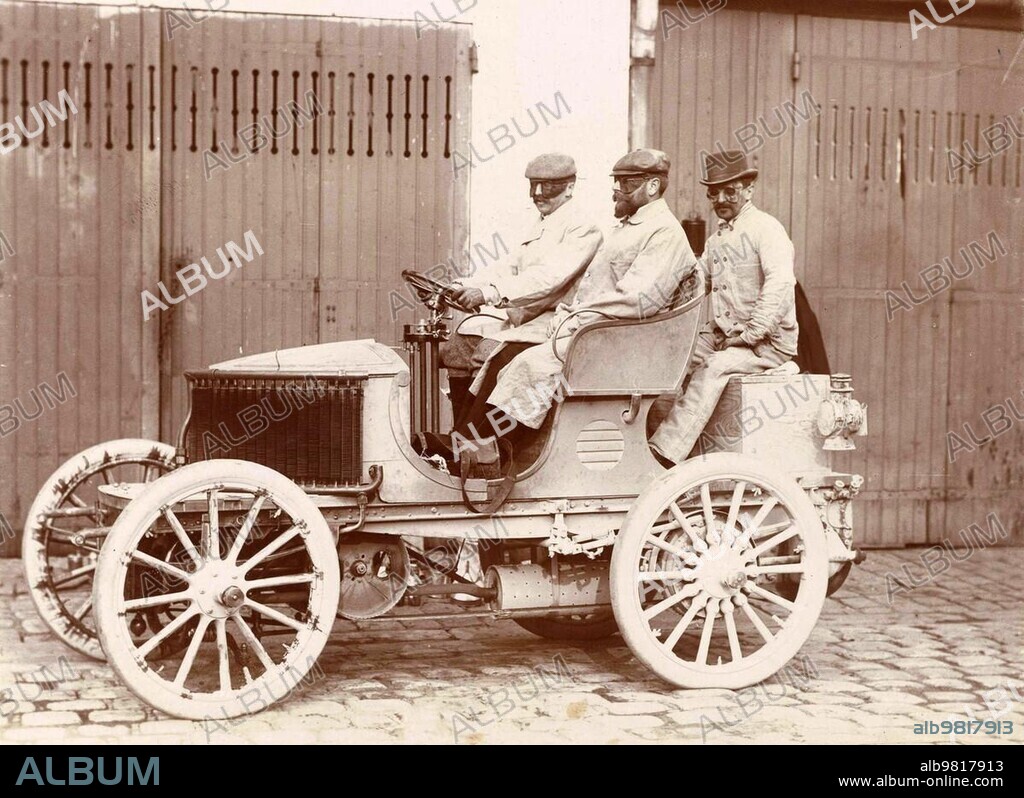 History of the Automobile, Three men with goggles in a car, probably in France, 1900, digitally restored reproduction from a 19th-20th century original