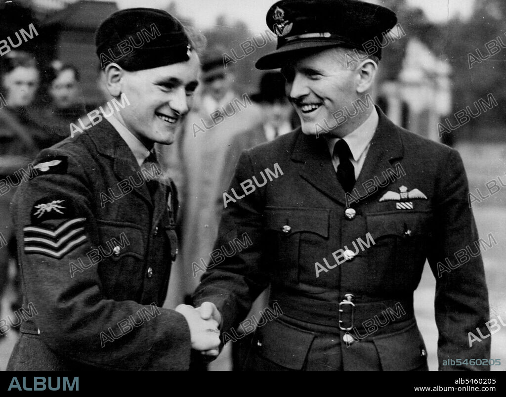 Sergeant Hannah V.C. being congratulated by his pilot, pilot officer C.A. Conner, who was decorated with the D.F.C. outside the palace to-day.***** Britain's youngest V.C.awarded his decoration for putting out a fire in a blazing aircraft was decorated by the King at Buckingham Palace to-day. Just out of hospital, recovering from extensive burns, Hannah had arrived home expecting three weeks leave. Instead he was recalled to London, and arrived here from Glasgow early this morning. October 10, 1940.