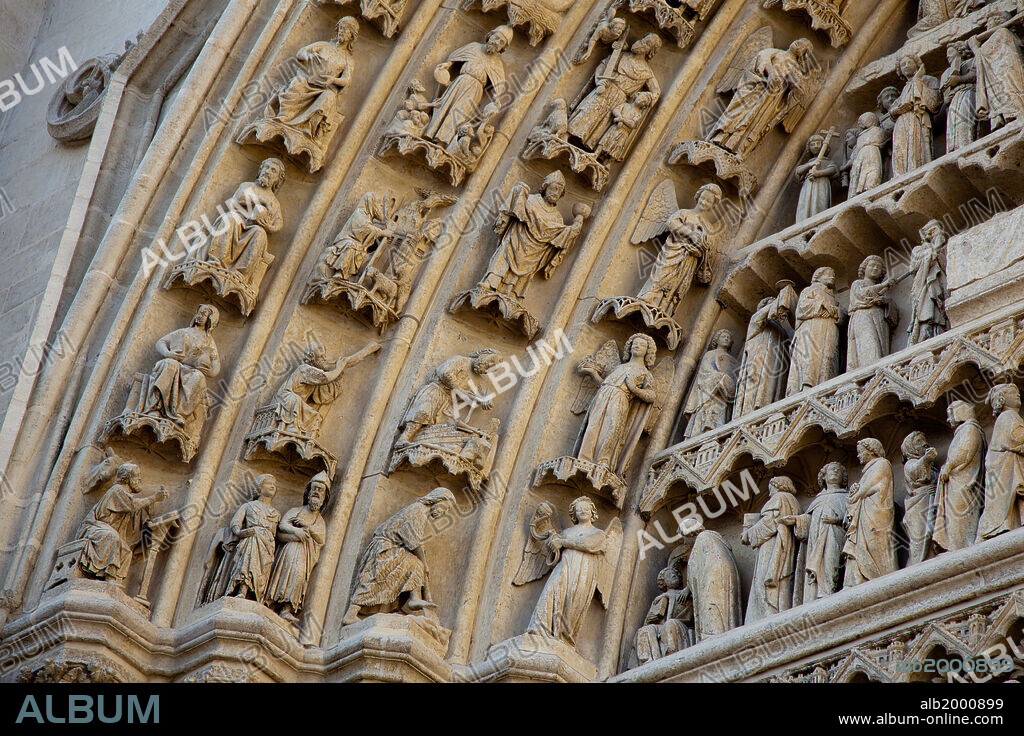 France, Amiens Cathedral (World Heritage Site), South Transept, Portal of the Golden Virgin. The portal of the south transept was probably built around 1245. The four archivolts are decorated with angles, with figures from the Old Testament; with prophets and the last voussoir with apostles, evangelists and women saints. The Cathedral of Notre Dame of Amiens was declared a World Heritage Site by UNESCO in 1981.