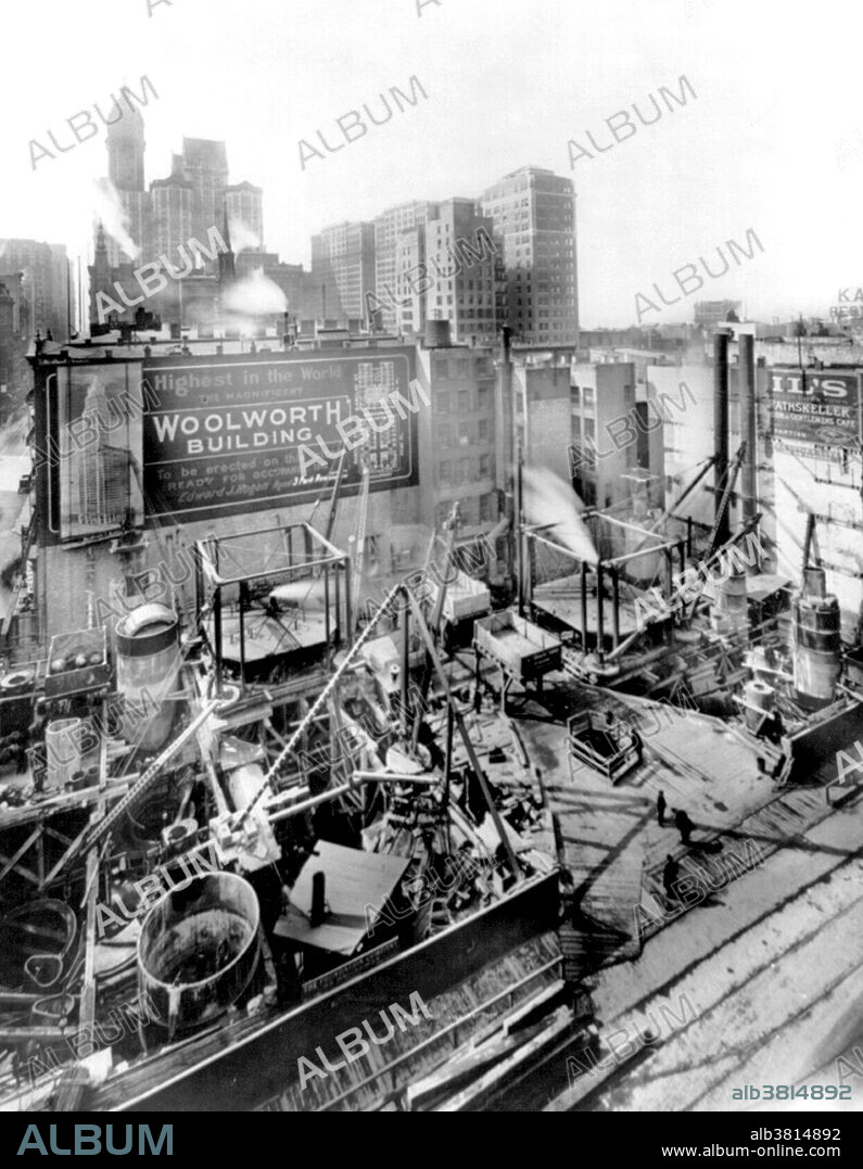 Woolworth Building foundations. The Woolworth Building, at 233 Broadway, Manhattan, New York City, designed by architect Cass Gilbert in the neo-Gothic style commissioned in 1910 to design a 20 story office building as the F. W. Woolworth Company's new corporate headquarters on Broadway, between Park Place and Barclay Street in Lower Manhattan, opposite City Hall. Originally designed to be 420 feet high, the building was eventually elevated to 792 feet. At its opening, the Woolworth Building was 60 stories tall and had over 5,000 windows. The construction cost was US$13.5 million. More than a century after the start of its construction, it remains one of the 100 tallest buildings in the United States as well as one of the 30 tallest buildings in New York City. It has been a National Historic Landmark since 1966, and a New York City landmark since 1983. Photographed by Irving Underhill, March 3, 1911.