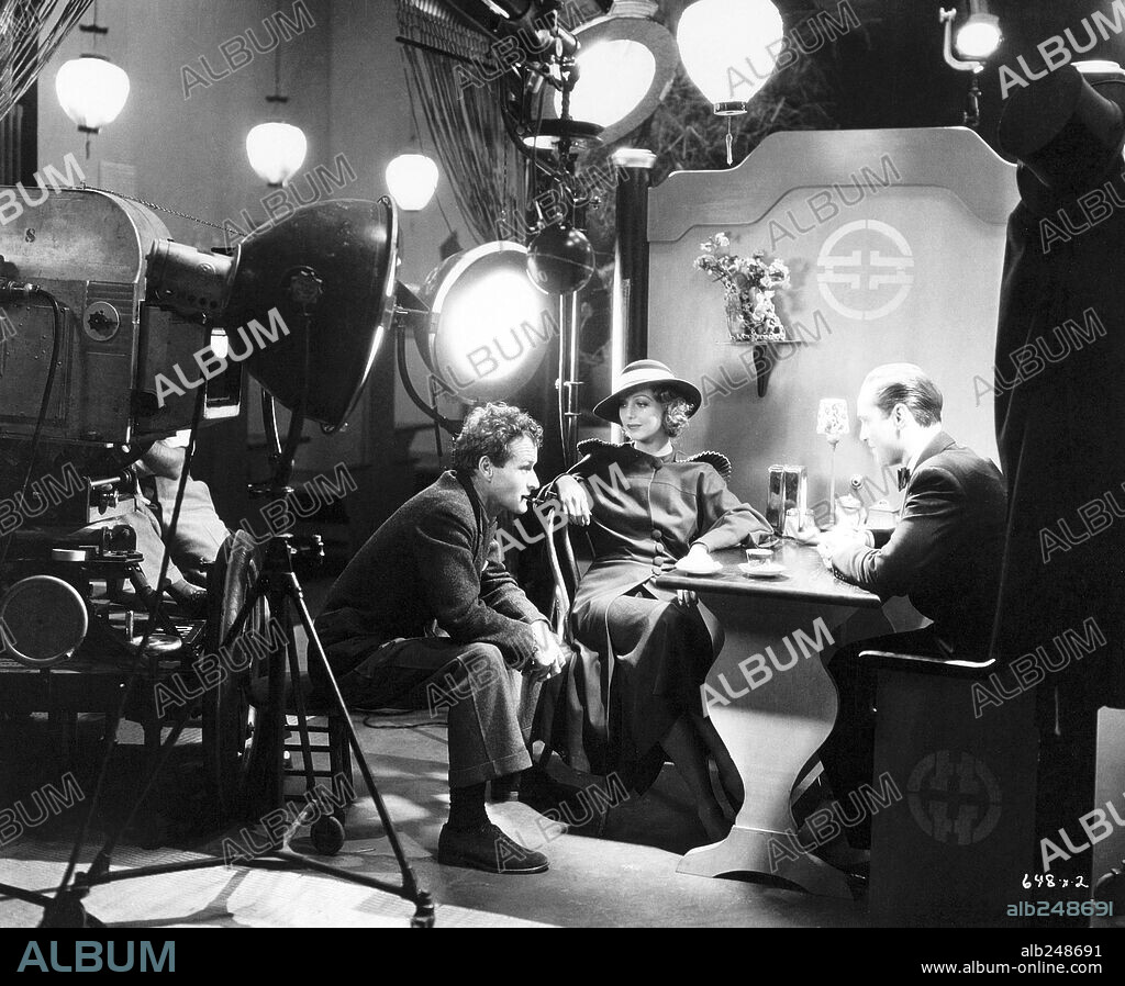 FRANCHOT TONE, LORETTA YOUNG and WILLIAM A. WELLMAN in MIDNIGHT MARY, 1933, directed by WILLIAM A. WELLMAN. Copyright METRO GOLDWYN MAYER.