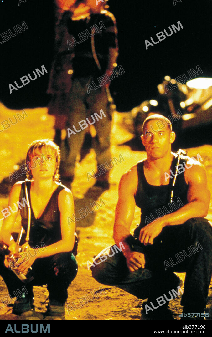 RADHA MITCHELL and VIN DIESEL in PITCH BLACK, 2000, directed by DAVID TWOHY. Copyright UNIVERSAL PICTURES.