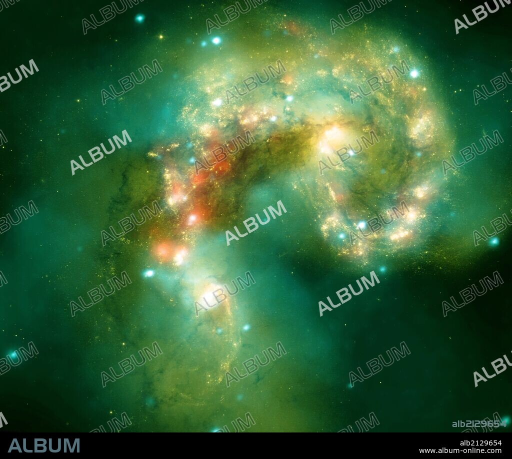 The Antennae galaxies, located about 62 million light-years from Earth, are shown in this composite image. The collision, which began more than 100 million years ago and is still occurring, has triggered the formation of millions of stars in clouds of dusts and gas in the galaxies. Hubble and Spitzer. (Photo by: Universal History Archive/UIG via Getty Images).