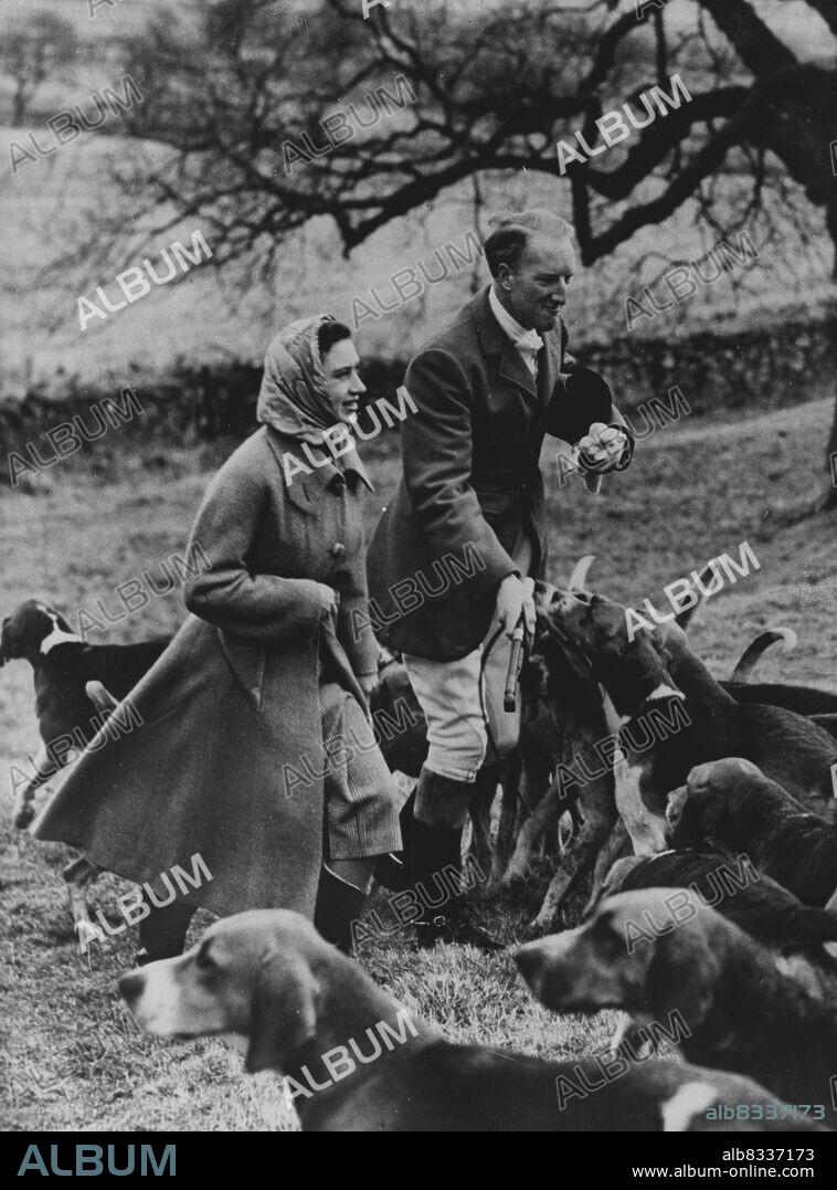 NC Lick for the Princess:- The hounds of the Berwickshire hunt press to lick the hand of the Earl of Dalkeith at a meet at home Castle, January 7 - Princess Margaret, Staying at nearby Marchmont house, Berwickshire, as the guest of captain and Mrs. J.H.F.McEwen, gave the hunt a royal send-off. January 08, 1952. (Photo by Associated Press Photo).