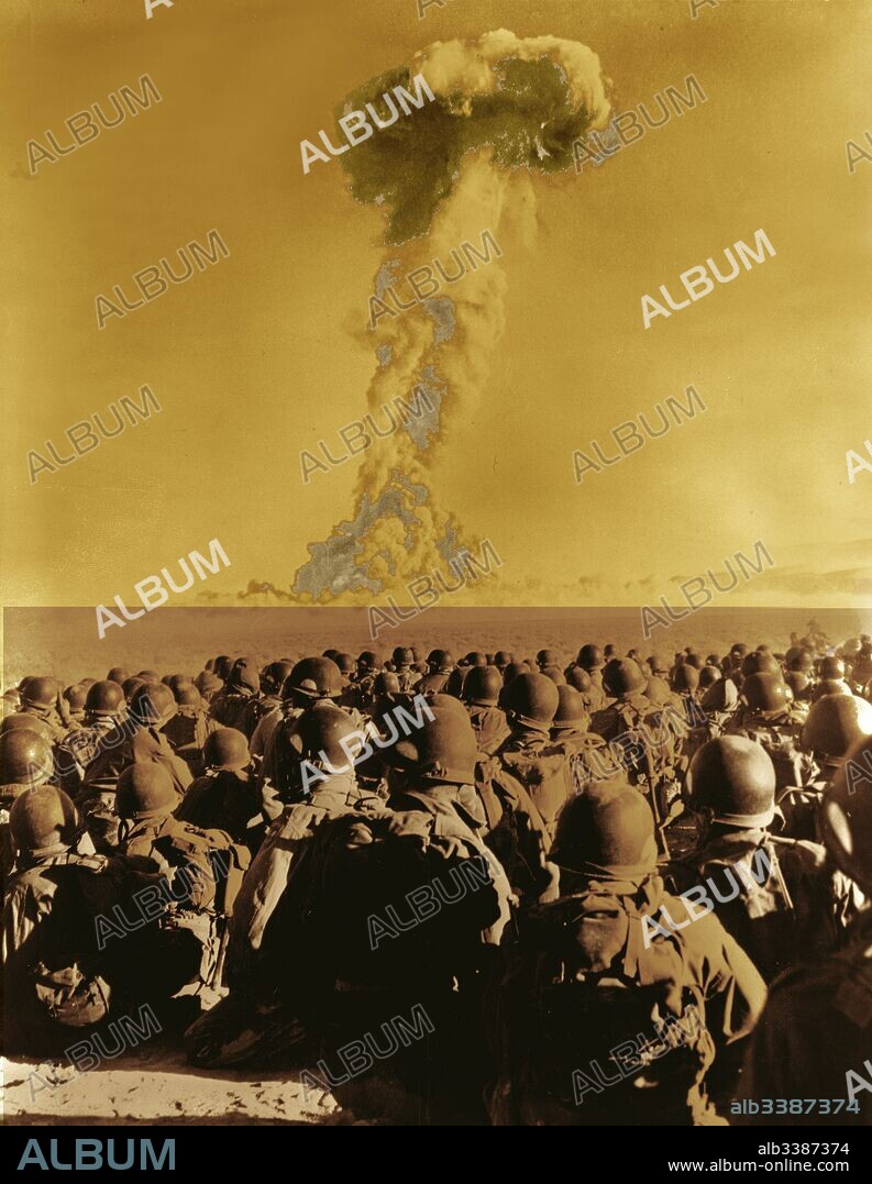 Nevada - Frenchman's Flat - members of 11th AB Div. kneel on ground as they watch mushroom cloud of atomic bomb test 1951.