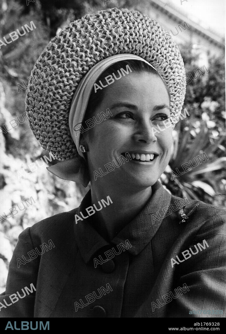 Grace Kelly smiling. The American actress Grace Kelly smiling on John Frankenheimer's 'Grand Prix' set. Monaco, 1966.