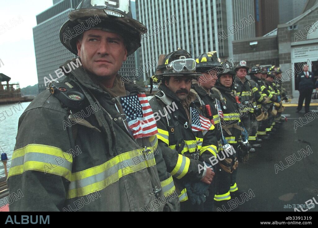 A line of firefighters await President George W Bush as he visits New York during the aftermath of the 9/11 incident, New York, New York, September 14, 2001. Image courtesy National Archives.