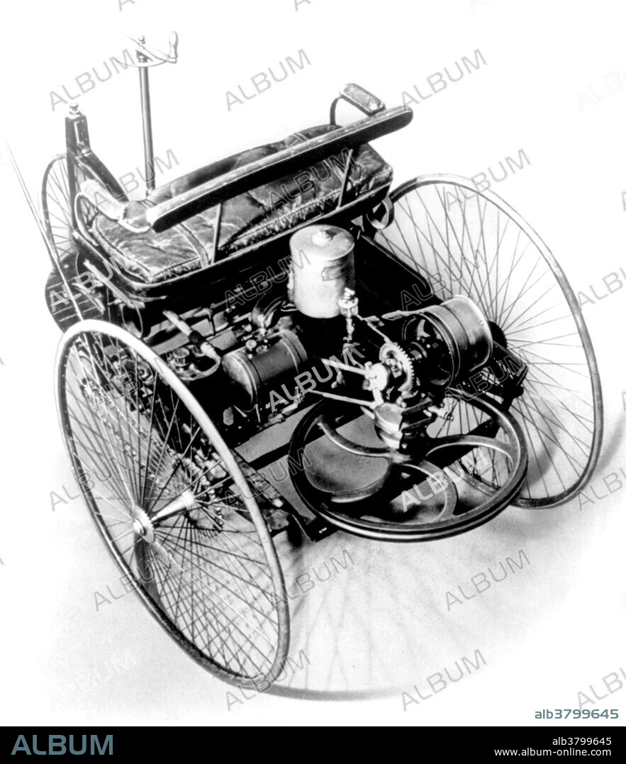 The Benz Patent-Motorwagen (or motorcar), built in 1886, is widely regarded as the world's first automobile; that is, a vehicle designed to be propelled by an internal combustion engine. The original cost of the vehicle in 1885 was $1,000 (equivalent to $26,337 in 2015). The vehicle was awarded the German patent, number 37435, for which Karl Benz applied on January 29, 1886. Following official procedures, the date of the application became the patent date for the invention once the patent was granted, which occurred in November of that year. The Benz Patent-Motorwagen was a three-wheeled automobile with a rear-mounted engine. The vehicle contained many new inventions. It was constructed of steel tubing with woodwork panels. The steel-spoked wheels and solid rubber tires were Benz's own design. Steering was by way of a toothed rack that pivoted the unsprung front wheel. Fully elliptic springs were used at the back along with a live axle and chain drive on both sides. A simple belt system served as a single-speed transmission, varying torque between an open disc and drive disc.