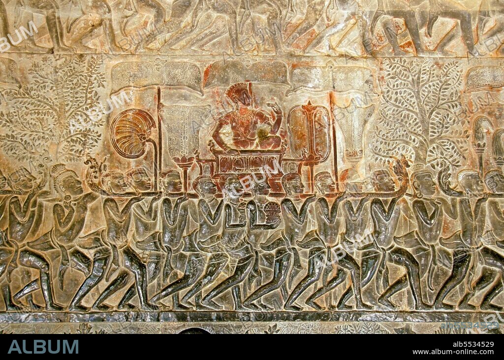 Angkor Wat was built for King Suryavarman II (ruled 1113-50) in the early 12th century as his state temple and capital city. As the best-preserved temple at the Angkor site, it is the only one to have remained a significant religious centre since its foundation – first Hindu, dedicated to the god Vishnu, then Buddhist. It is the world's largest religious building. The temple is at the top of the high classical style of Khmer architecture. It has become a symbol of Cambodia, appearing on its national flag, and it is the country's prime attraction for visitors. Angkor Wat combines two basic plans of Khmer temple architecture: the temple mountain and the later galleried temple, based on early South Indian Hindu architecture. It is designed to represent Mount Meru, home of the devas in Hindu mythology: within a moat and an outer wall 3.6 kilometres (2.2 mi) long are three rectangular galleries, each raised above the next. At the centre of the temple stands a quincunx of towers.