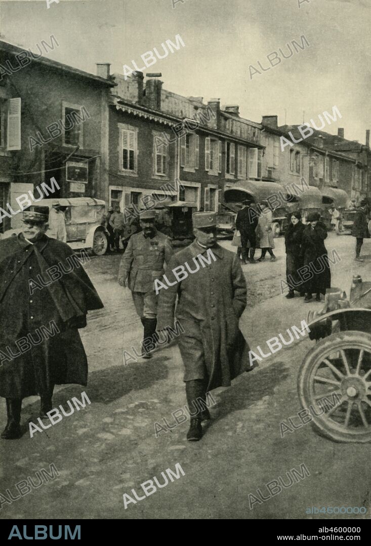General Joffre and General Pétain, Verdun, northern France, First World War, 1916, (c1920). 'The Defender of Verdun: General Pétain (centre) walking with General Joffre on his right'. French military commanders General Joseph Joffre (1852-1931) and General Philippe Pétain (1856-1951). From "The Great World War: A History", Volume V, edited by Frank A Mumby. [The Gresham Publishing Company Ltd, London, c1920].