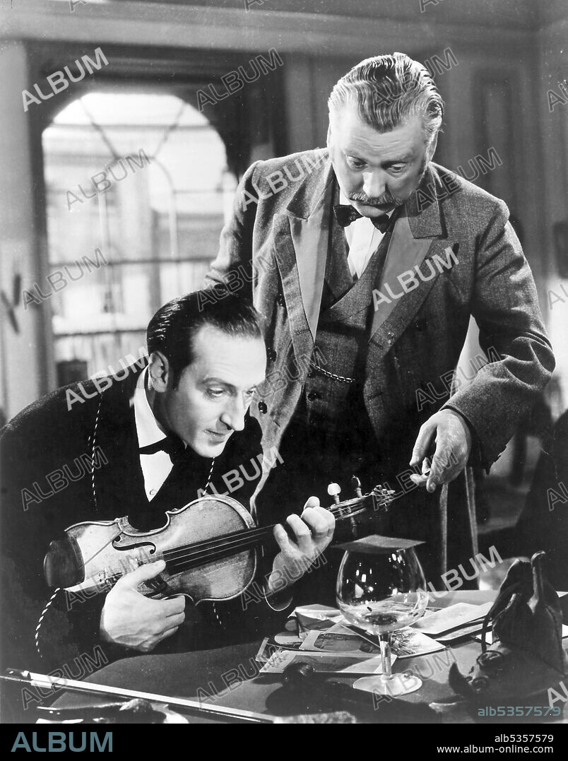 BASIL RATHBONE and NIGEL BRUCE in THE ADVENTURES OF SHERLOCK HOLMES, 1939, directed by ALFRED L. WERKER. Copyright 20TH CENTURY FOX.