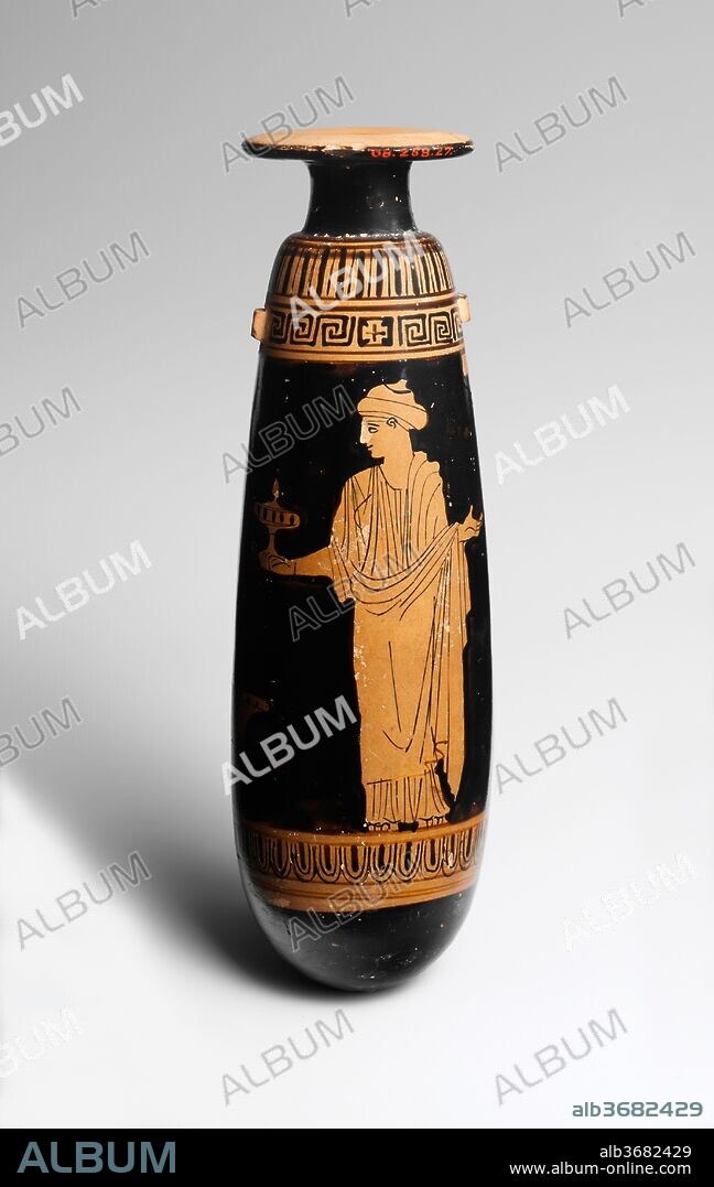 Terracotta alabastron (perfume vase). Culture: Greek, Attic. Dimensions: H. 6 13/16 in. (17.3 cm)
diameter  2 in. (5.1 cm). Date: ca. 440 B.C..
Obverse, woman with mirror
Reverse, woman with plemochoe (perfume vase)
The column indicates that the scene is set indoors, and the kalathos (wool basket) on the ground suggests the ladies' occupation. The representation of each figure is noteworthy. The one with the mirror wears a peplos and her hair is bound with fillets. She appears younger. The other is dressed in a chiton and himation with her hair in a sakkos (snood). The Persephone Painter, whose masterpiece is displayed in the Jaharis Gallery on the main floor, characterizes figures with utmost economy.