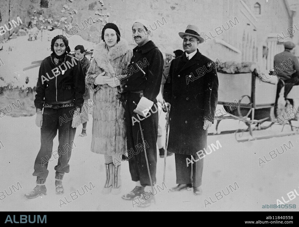 The Maharajah of Indore with his American wife . Pictured with the Maharani ( formerly Miss Nancy Miller ) at St Moritz where they are taking part in sport . 17 January 1931.