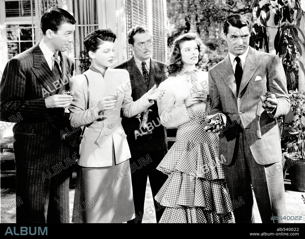 CARY GRANT, JAMES STEWART, JOHN HOWARD, KATHARINE HEPBURN and RUTH HUSSEY in THE PHILADELPHIA STORY, 1940, directed by GEORGE CUKOR. Copyright M.G.M.