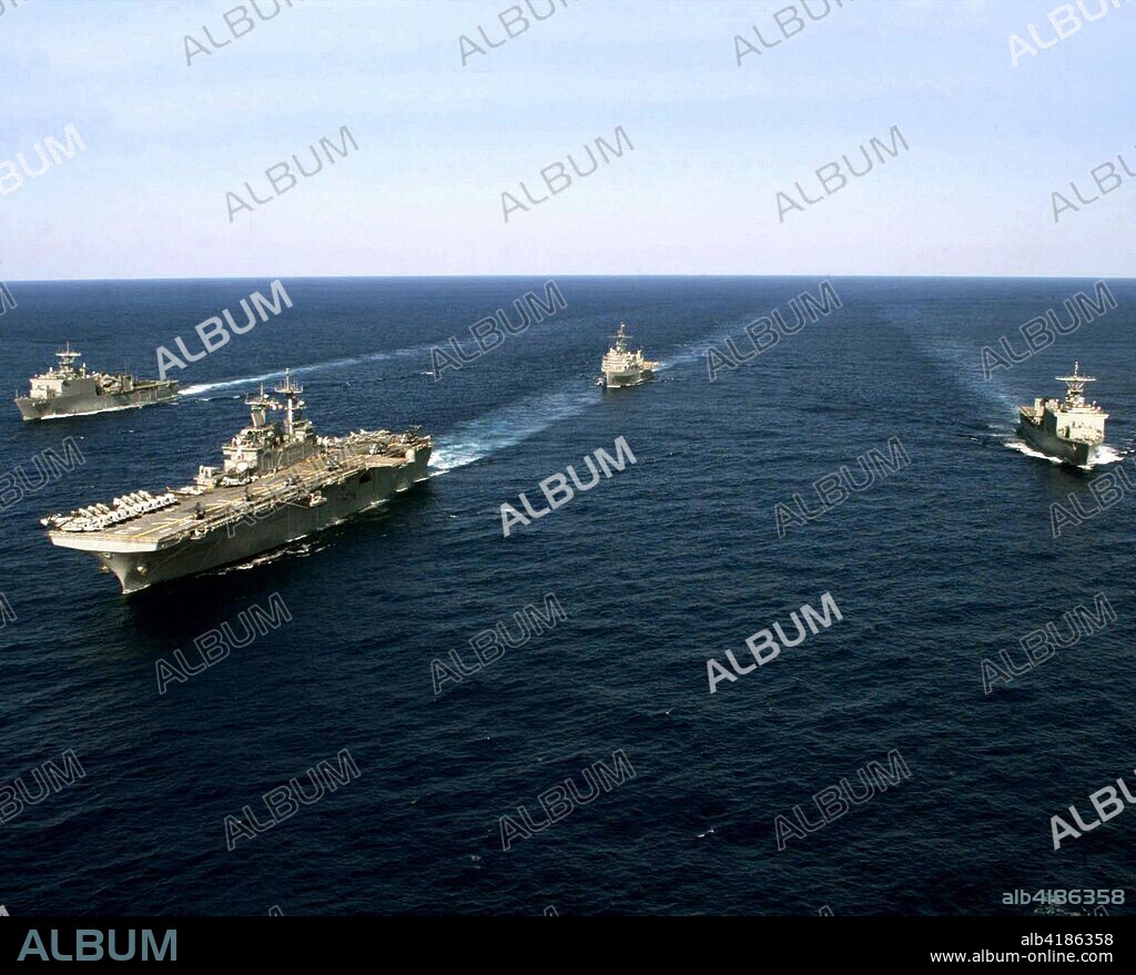 "US Navy (USN) SHIPs assigned to the Essex AMPHIBIOUS Ready Group UNDERWAY in the Pacific Ocean, while conducting a semi-annual AMPHIBIOUS integration training exercise known as the Blue-Green Workups. Pictured left-to-right, the WHIDBEY ISLAND CLASS: Dock Land SHIP, the USS GERMANTOWN (LSD 42), WASP CLASS: AMPHIBIOUS ASSAULT SHIP, USS ESSEX (LHD 2), the AUSTIN CLASS: AMPHIBIOUS Transport Dock, USS JUNEAU (LPD 10) and the USS FORT McHENRY (LSD 43).