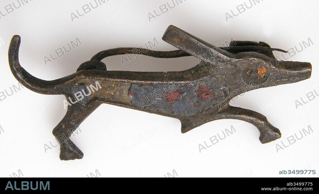 Brooch in the Form of a Dog, 2nd century, Roman, Champlevé enamel, bronze, Overall: 3/4 x 1 11/16 x 1/4 in. (1.9 x 4.3 x 0.7 cm), Enamels-Champlevé, Small brooches, often in whimsical animal forms, were worn both by Roman soldiers stationed in the provinces and by the native population. Though brooches in these forms appear throughout the Roman world, the distribution of finds and the archaeological remains of workshops suggest that the major centers of production were Britain and Gaul.