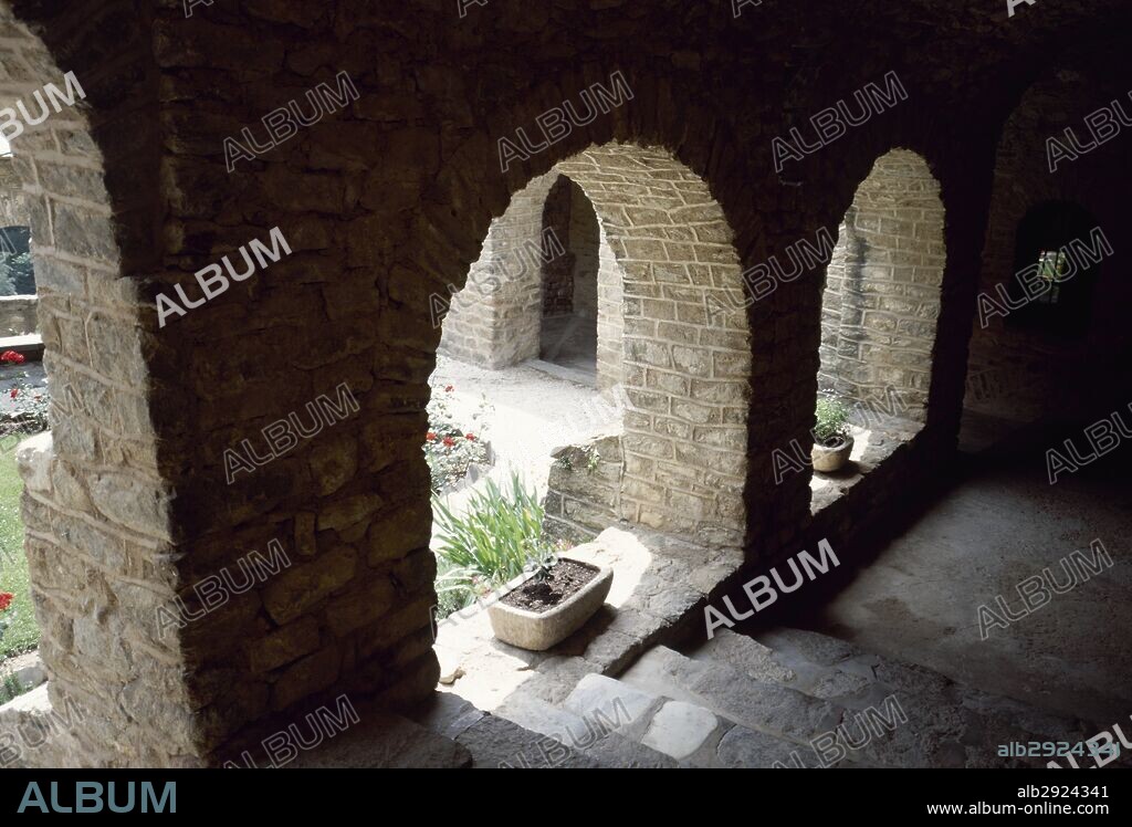 France. Pyrenees-Orientales. Languedoc-Roussillon region. Abbey of Saint-Martin-du-Canigou. Monastery built in 1009, on Canigou mountain. It was built from 1005-1009 by Guifred, Count of Cerdanya in Romanesque style. Cloister. Architectural detail of the galleries. Restoration of 1900-1920.