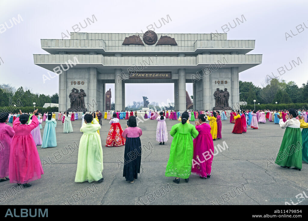 Women in colourful traditional dresses at mass dancing, Pyongyang, Democratic People's Republic of Korea (DPRK), North Korea, Asia.