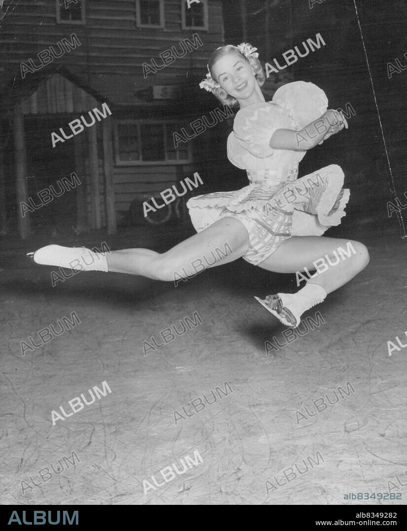 Rose Marie's Stag Jump -- ***** skater *****, Canada's  Barbara Ann Scott former world champion figure skater, sails ***** the air during a ***** the new London Ice show, ***** Maria on 'Ice', at the ***** Arena, today Wednesday, Barbara Ann is executing ***** stag jump.Her skates flashing, Canada's Barbara Ann Scott, former world champion figure skater, sails through the air during rehearsal in London for Rosemarie On Ice. Barabara Ann is rehearsing the "stag jump."  June 27, 1951. (Photo by Reuterphoto).