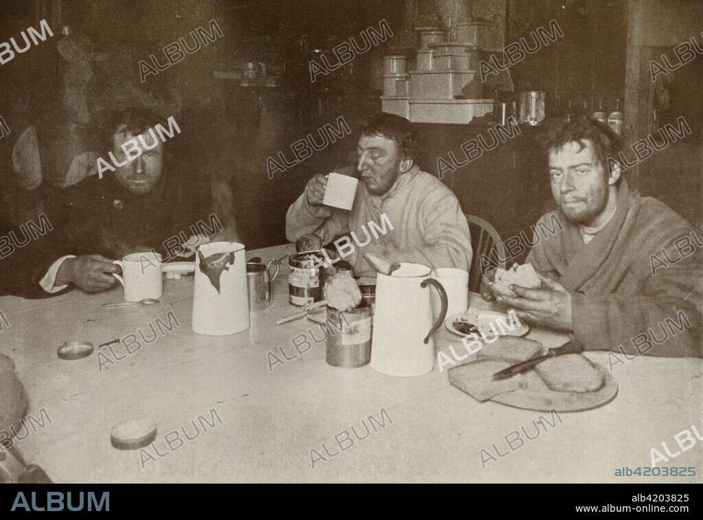 'Wilson, Bowers, and Cherry-Garrard on Their Return from Cape Crozier', 1 August 1911, (1913). Doctor and naturalist Edward Wilson (1872-1912), Lieutenant Henry 'Birdie' Bowers (1883-1912) and zoologist Apsley Cherry-Garrard (1886-1959) after their journey to Cape Crozier to collect Emperor Penguin eggs. The final expedition of British Antarctic explorer Captain Robert Falcon Scott (1868-1912) left London on 1 June 1910 bound for the South Pole. The Terra Nova Expedition, officially the British Antarctic Expedition (1910-1913), included a geologist, a zoologist, a surgeon, a photographer, an engineer, a ski expert, a meteorologist and a physicist among others. Scott wished to continue the scientific work that he had begun when leading the Discovery Expedition to the Antarctic in 1901-04. He also wanted to be the first to reach the geographic South Pole. Scott, accompanied by Dr Edward Wilson, Captain Lawrence Oates, Lieutenant Henry Bowers and Petty Officer Edgar Evans, reached the Pole on 17 January 1912, only to find that the Norwegian expedition under Amundsen had beaten them to their objective by a month. Delayed by blizzards, and running out of supplies, Scott and the remainder of his team died at the end of March. Their bodies and diaries were found eight months later. From Scott's Last Expedition, Volume II. [Smith, Elder & Co., London, 1913].