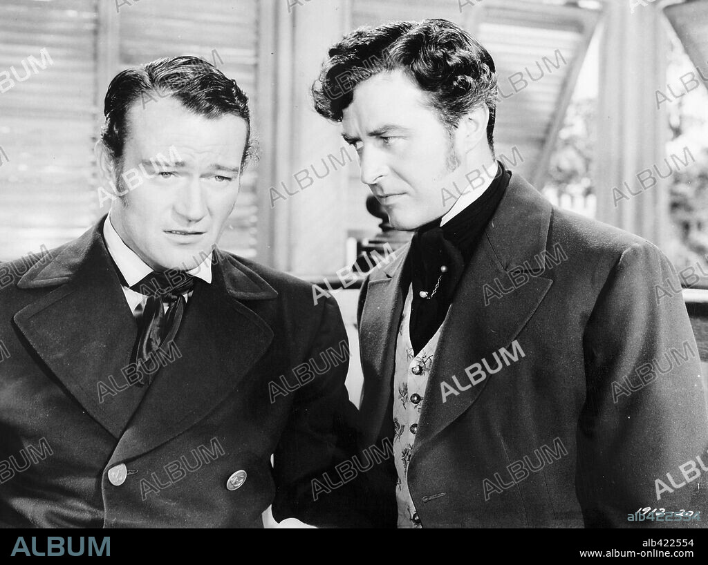 JOHN WAYNE and RAY MILLAND in REAP THE WILD WIND, 1942, directed by CECIL B DEMILLE. Copyright PARAMOUNT PICTURES.