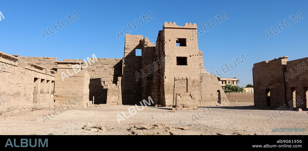 Migdol Tower at the Temple of Rameses II at Medinet Habu, Egypt. in front of the first pylon, of a tower built in the form of a Migdol (a military fortress in Asia Minor) which gave the Temple the aspect of a fortress and had protective functions in the large wall surrounding the Temple.