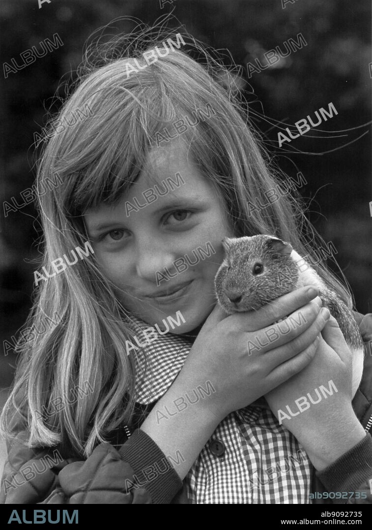 Lady Diana Spencer and her guinea pig called Peanuts.