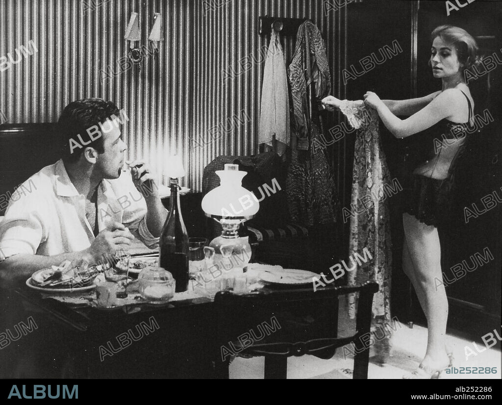 ANNIE GIRARDOT and RENATO SALVATORI in ROCCO AND HIS BROTHERS, 1960 (ROCCO E I SUOI FRATELLI), directed by LUCHINO VISCONTI. Copyright TITANUS/LES FILMS MARCEAU.