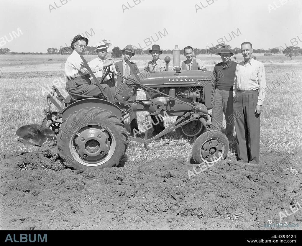 Negative - International Harvester, Hamilton Group with Farmall A Tractor, 1940, Part of a large collection of glass plate and film negatives, transparencies, photo albums, product catalogues, videos, motion picture films, company journals, advertisements and newspaper cuttings relating to the operations of the International Harvester Company and its subsidiaries in Australia. The International Harvester Company of America was formed in 1902 by the merger of five leading.