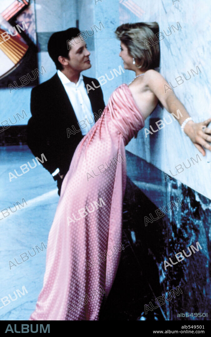 HELEN SLATER and MICHAEL J. FOX in THE SECRET OF MY SUCCE$S, 1987, directed by HERBERT ROSS. Copyright UNIVERSAL PICTURES.