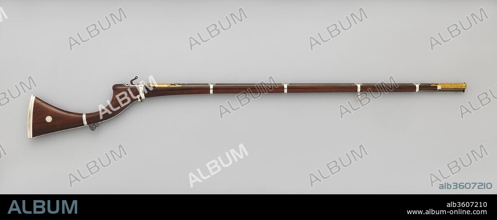 Matchlock Rifle. Culture: Indian, Sind (now Pakistan). Dimensions: L. 60 in. (152.4 cm); L. of barrel 44 3/8 in. (112.6 cm); Cal. .53 in. (13 mm); Wt. 7 lb. 4 oz. (3291 g). Date: second quarter of the 19th century.
The deeply curved butt of this hunting gun is characteristic of firearms made in the Sind region of northwest India (now Pakistan). The fine workmanship, particularly the forge-welded barrel with its complicated twist pattern and delicate gold-damascened ornament, reflects the revival of the decorative arts sponsored by the Talpur dynasty that ruled Sind from 1783 to 1843. The barrel is inscribed with the name of one of the ruling family, Sarkar Mir Muhammad Nasir Khan Talpur (d. 1845).