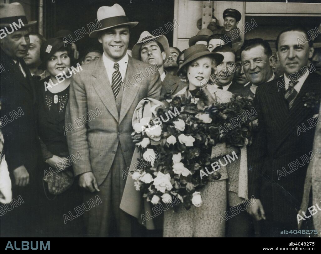 Max Schmeling and Anny Ondra arrive in Barcelona, Spain, 1933. Czech film actress Anny Ondra (1903-1987) and German boxer Max Schmeling (1905-2005) married on 6 July 1933. They remained happily married until her death in 1987. Schmeling is best remembered for his two world heavyweight championship fights against Joe Louis in the late 1930s.