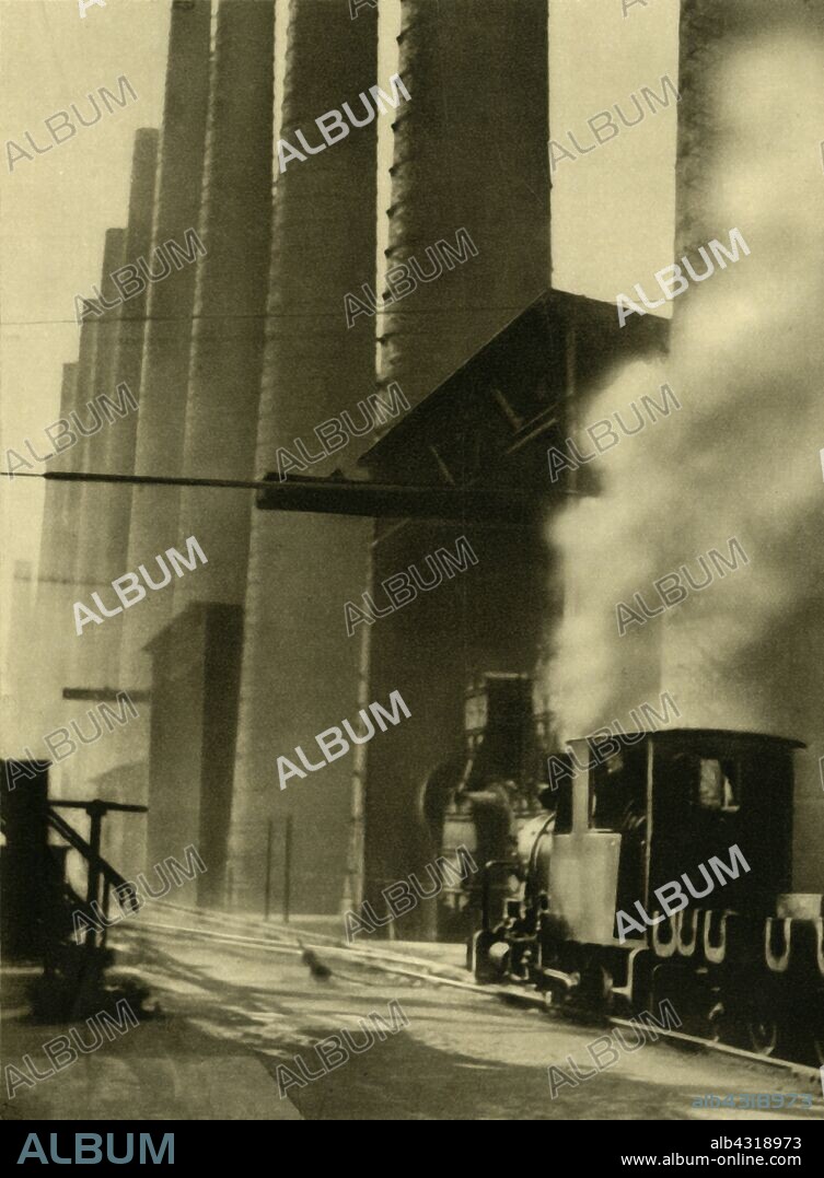 Blast furnaces, Donawitz, Austria, c1935. Steam locomotive at the steel-making industrial complex near Leoben in Styria. From "Österreich - Land Und Volk", (Austria, Land and People). [R. Lechner (Wilhelm Müller), Vienna, c1935].