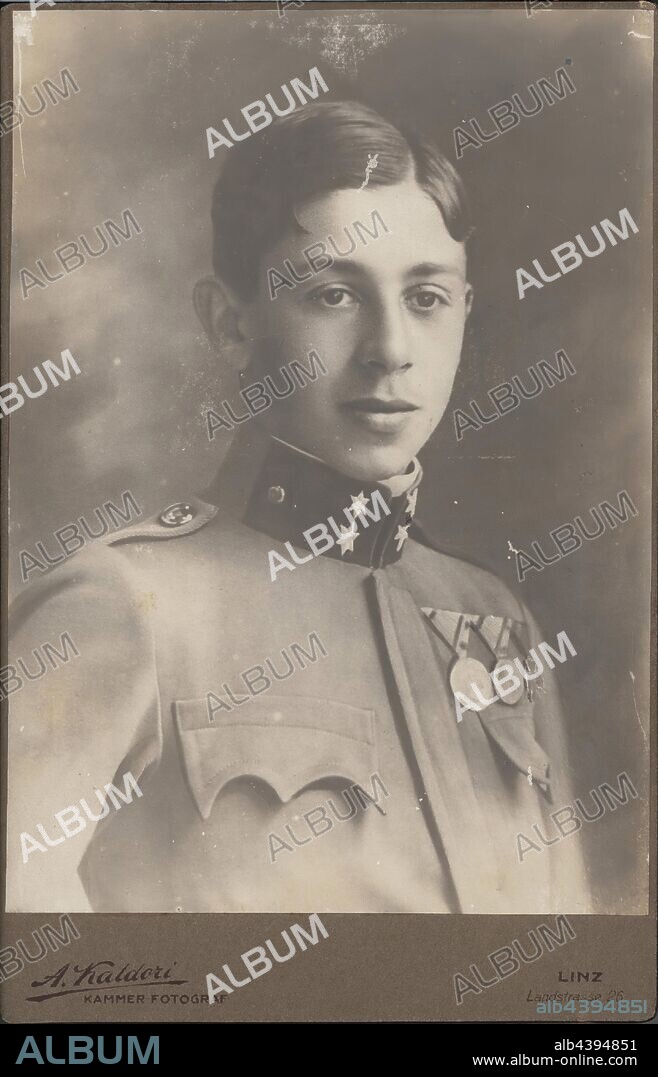 Photograph - Leo Sterne in Military Uniform, Austria, circa 1917, Black and white studio portrait mounted on cardboard, depicting Leo Stern as a young man dressed in Austrian military uniform circa 1917. This photograph relates to the lives of Leo and Hilda Sterne prior to their migration to Australia from Linz, Austria in 1939, joining other family members who had arrived in 1938. The Sternes (originally Sternschein), listed as 'stateless', were probably.