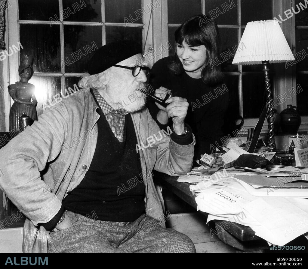 Fordingbridge , Hants . Famous painter, philosopher abnd philantropist Augustus John is seen here in the sudy of his home , Freyn Court , with his step-granddaughter Talitha , aged 20 .. Talitha , the step-daughter of Augustus John 's daughter Poppet lives at St Tropez with Poppet and her husband , well known Dutch painter Willem Jilts Pol . A former TV and magazine model Talitha has just finished studying at the Royal Academy of Dramatic Art and hopes soon to start her acting career. 3 January 1961.